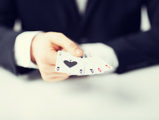 Image showing man hand showing four aces