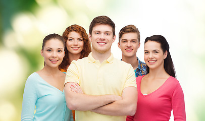 Image showing group of smiling teenagers over green background