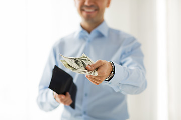 Image showing close up of businessman hands holding money