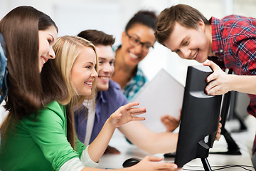 Image showing students looking at computer monitor at school