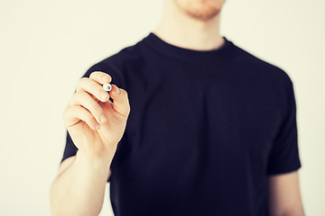 Image showing man writing something in the air