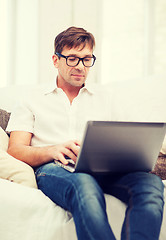 Image showing man working with laptop at home