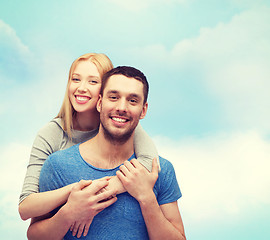 Image showing smiling couple hugging