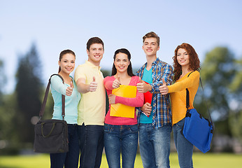 Image showing group of smiling teenagers showing thumbs up