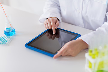 Image showing close up of scientist with tablet pc in lab