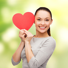 Image showing smiling asian woman with red heart