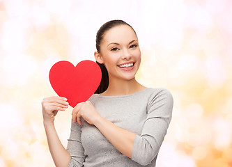 Image showing smiling asian woman with red heart