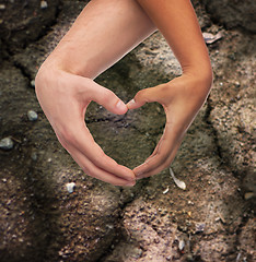 Image showing woman and man hands showing heart shape