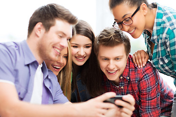 Image showing students looking at smartphone at school