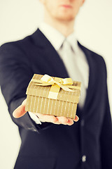 Image showing man hands holding gift box