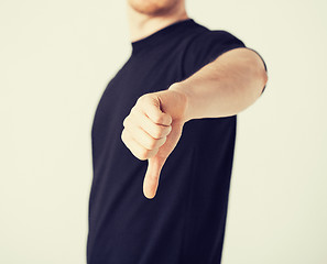 Image showing man showing thumbs down