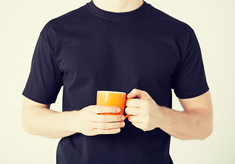 Image showing man hands holding cup of coffee