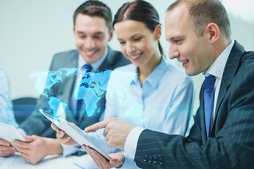 Image showing business team with tablet pc having discussion