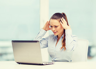 Image showing stressed woman with laptop