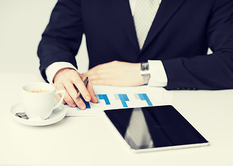 Image showing man with tablet pc and cup of coffee