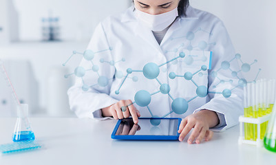 Image showing close up of scientist with tablet pc in laboratory