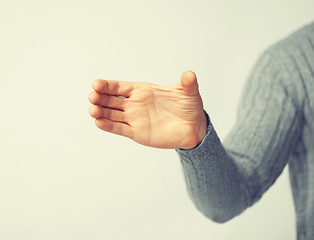 Image showing man holding imaginary object