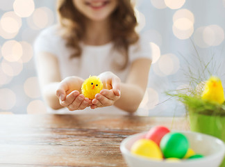 Image showing close up of girl holding easter chicken toy