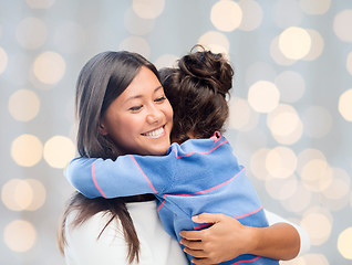 Image showing happy mother and daughter hugging