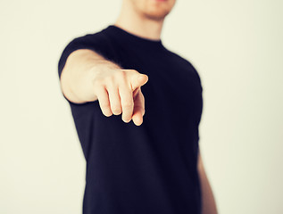 Image showing man pointing his finger at you