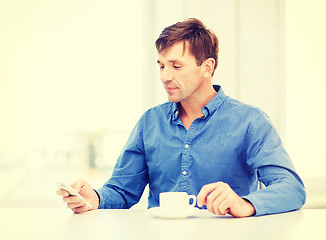 Image showing buisnessman with smartphone and cup of coffee