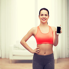 Image showing sporty woman with smartphone