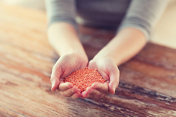 Image showing cloes up of female cupped hands with quinoa