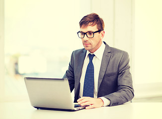 Image showing businessman working with laptop computer