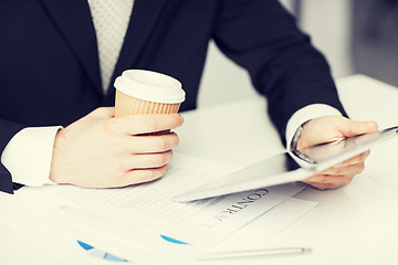 Image showing man with tablet pc and cup of coffee