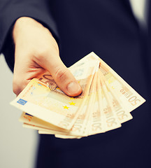 Image showing man in suit with euro cash money