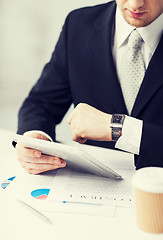 Image showing man with tablet pc and cup of coffee