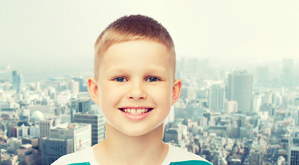 Image showing smiling little boy over green background