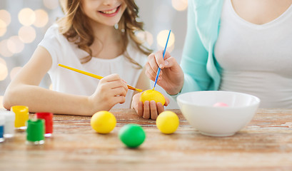 Image showing close up of family coloring easter eggs