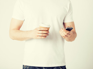 Image showing man with smartphone and coffee