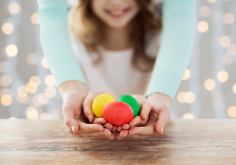 Image showing close up of happy family holding easter eggs