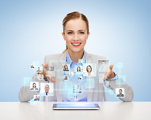 Image showing businesswoman with tablet pc and icons of contacts