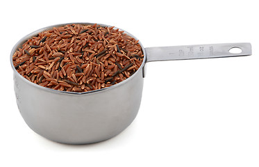 Image showing Camargue red rice grains in a cup measure