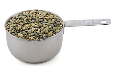 Image showing Marbled dark green lentils in a cup measure