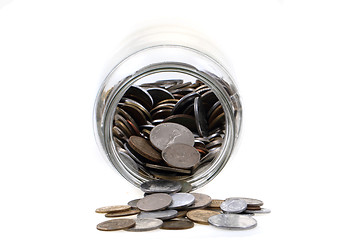 Image showing old european coins in glass botlle 