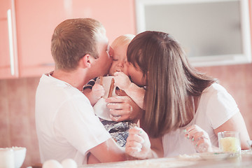 Image showing Happy smiling family at kitchen