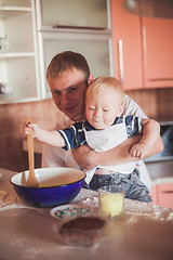 Image showing Father and son cooking