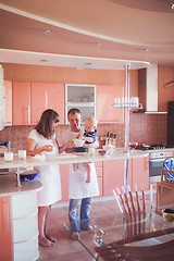 Image showing Happy family cooking at kitchen