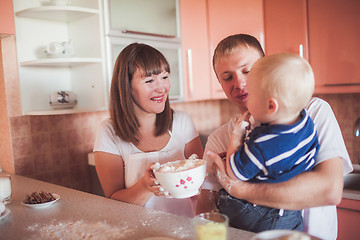 Image showing Happy family cooking at kitchen