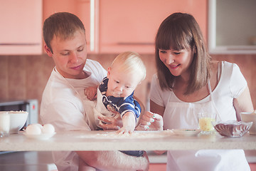 Image showing Happy family cooking at kitchen