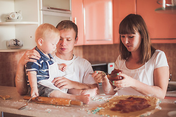 Image showing Happy family cooking at kitchen