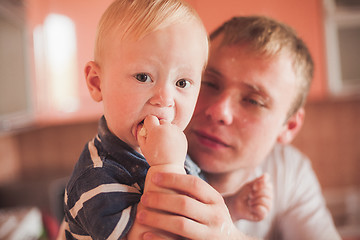 Image showing Father and son cooking