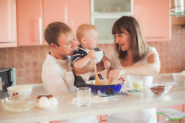 Image showing Happy family cooking at kitchen