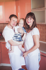 Image showing Happy smiling family at kitchen