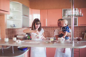 Image showing Happy family cooking at kitchen