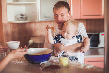 Image showing Father and son cooking